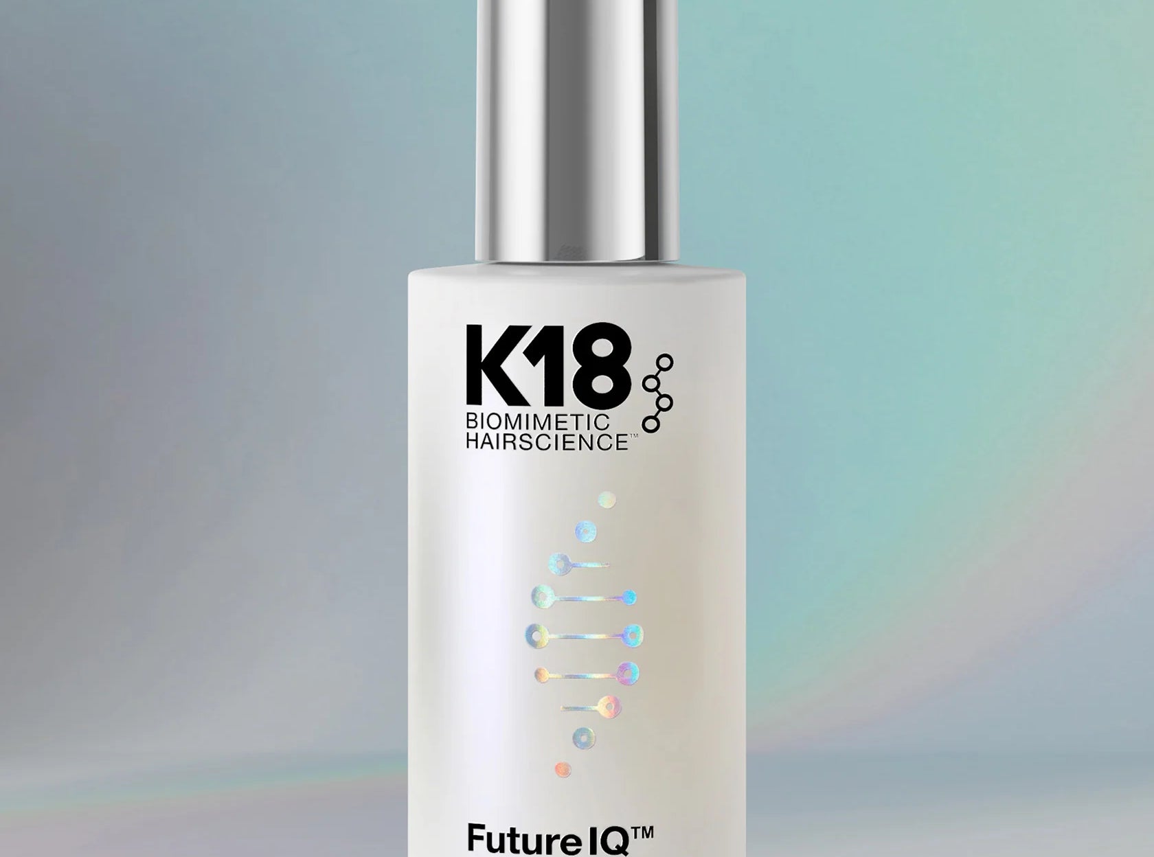 K18 hair serum dropper bottle on a gradient background