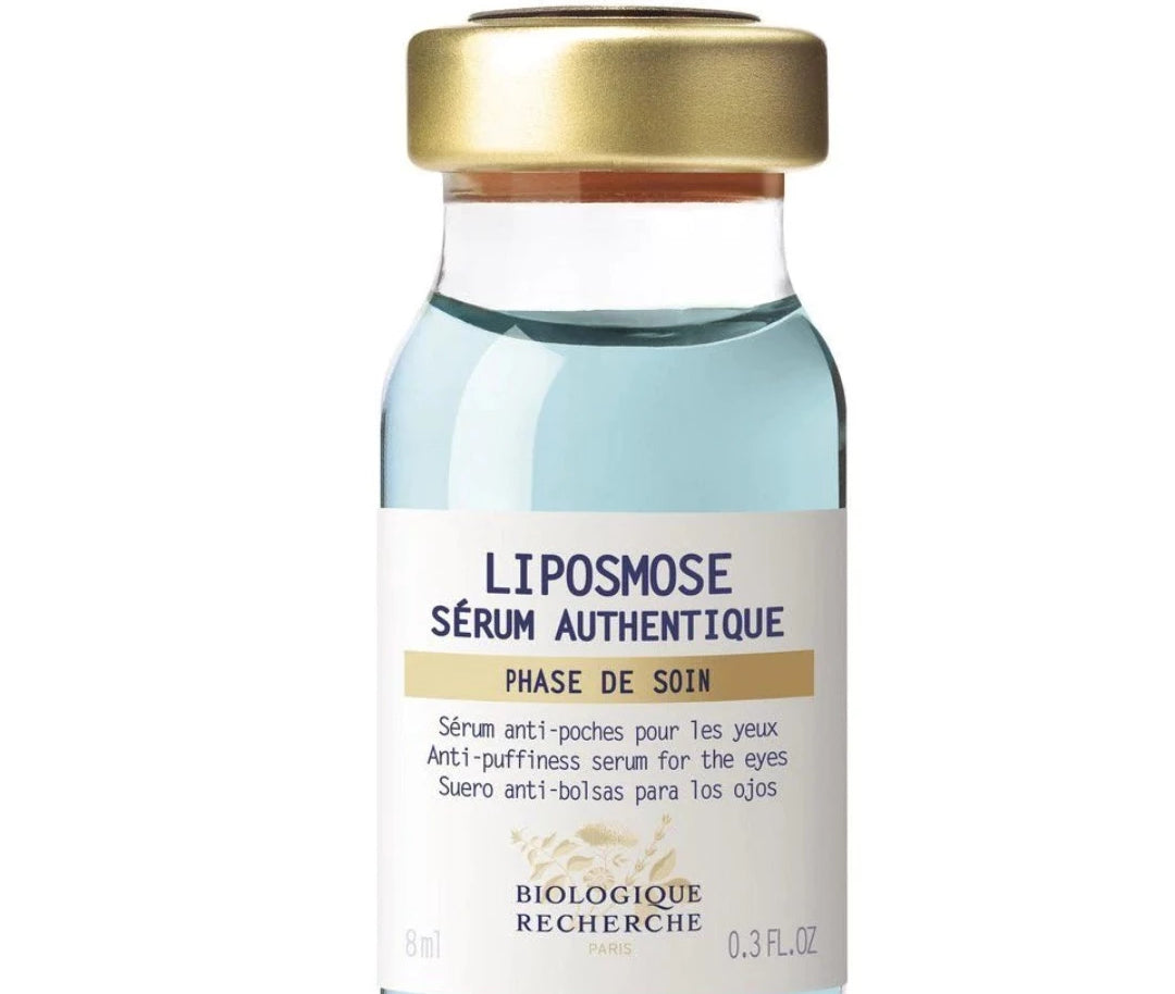 Glass vial with blue lique to depuff eyes